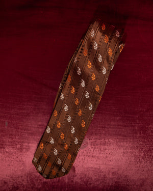 Patterned tie on a textured red background