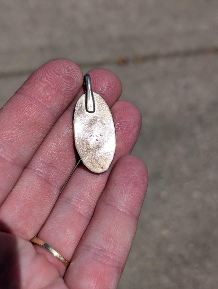 Vintage southwestern shadowbox pendant with Malachite center. Stamped with the Hallmark letter K
