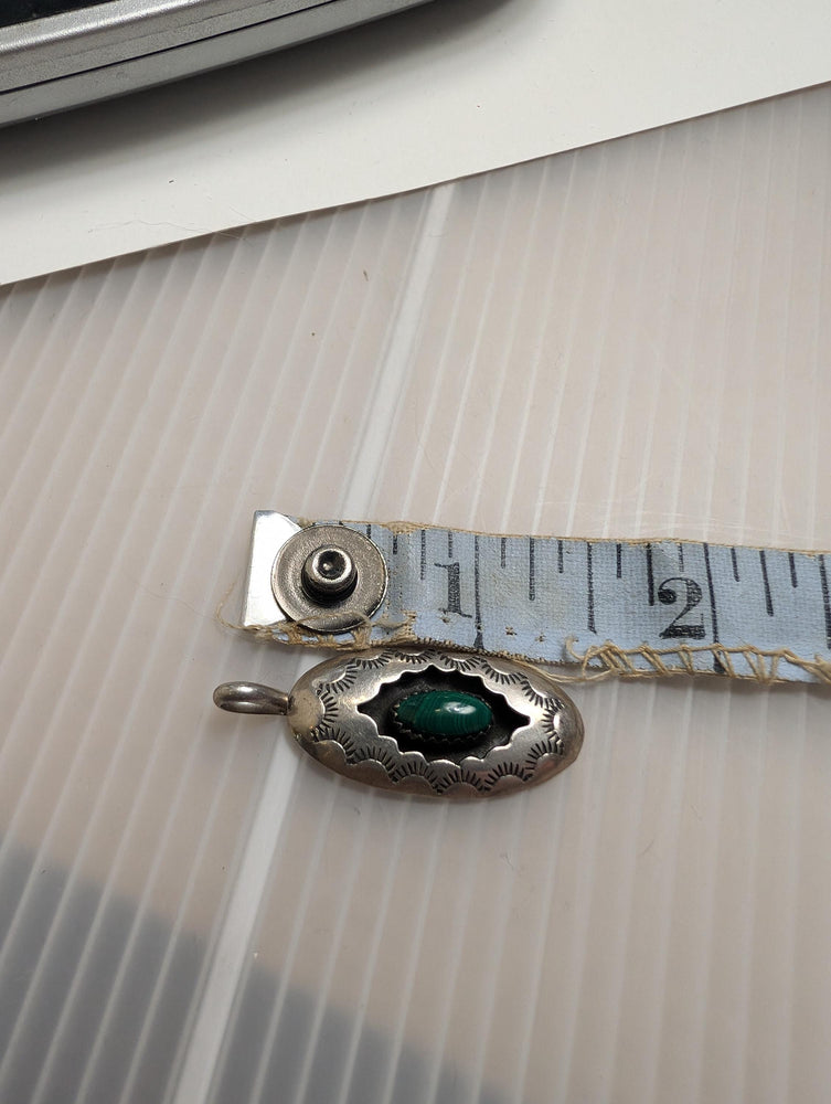 Vintage southwestern shadowbox pendant with Malachite center. Stamped with the Hallmark letter K