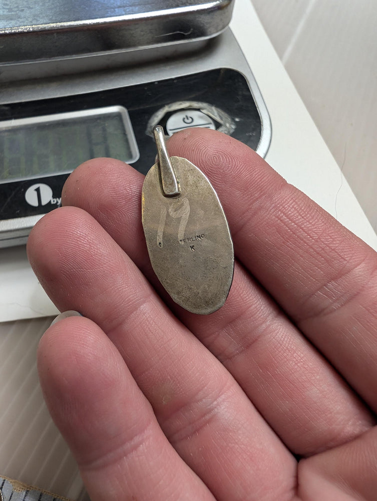 Vintage southwestern shadowbox pendant with Malachite center. Stamped with the Hallmark letter K