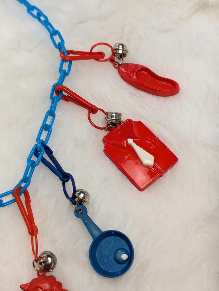 80s bell charm clip necklace full of color, fun, and kitsch! Blue and red