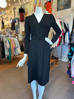 Black dress on a mannequin in a clothing store