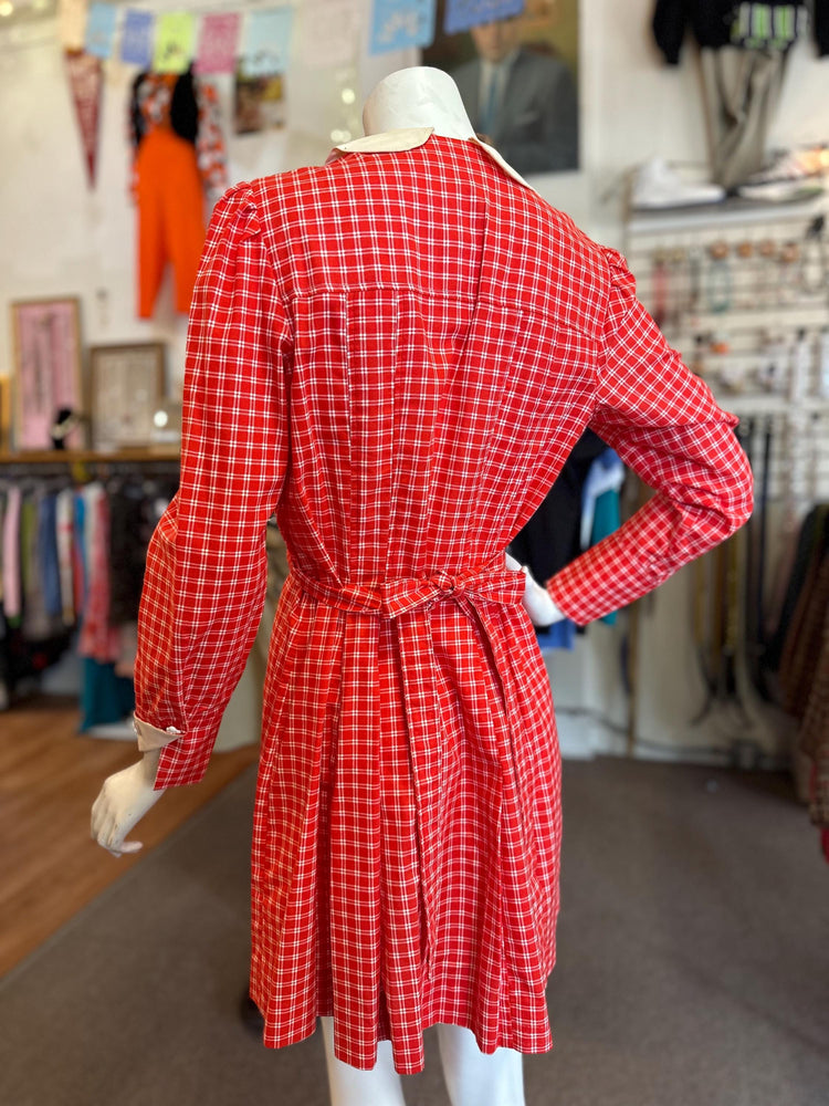 Red checkered dress on a mannequin in a store setting