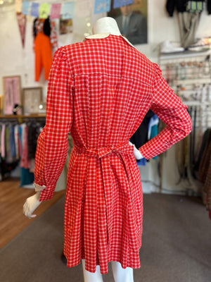Red checkered dress on a mannequin in a store setting
